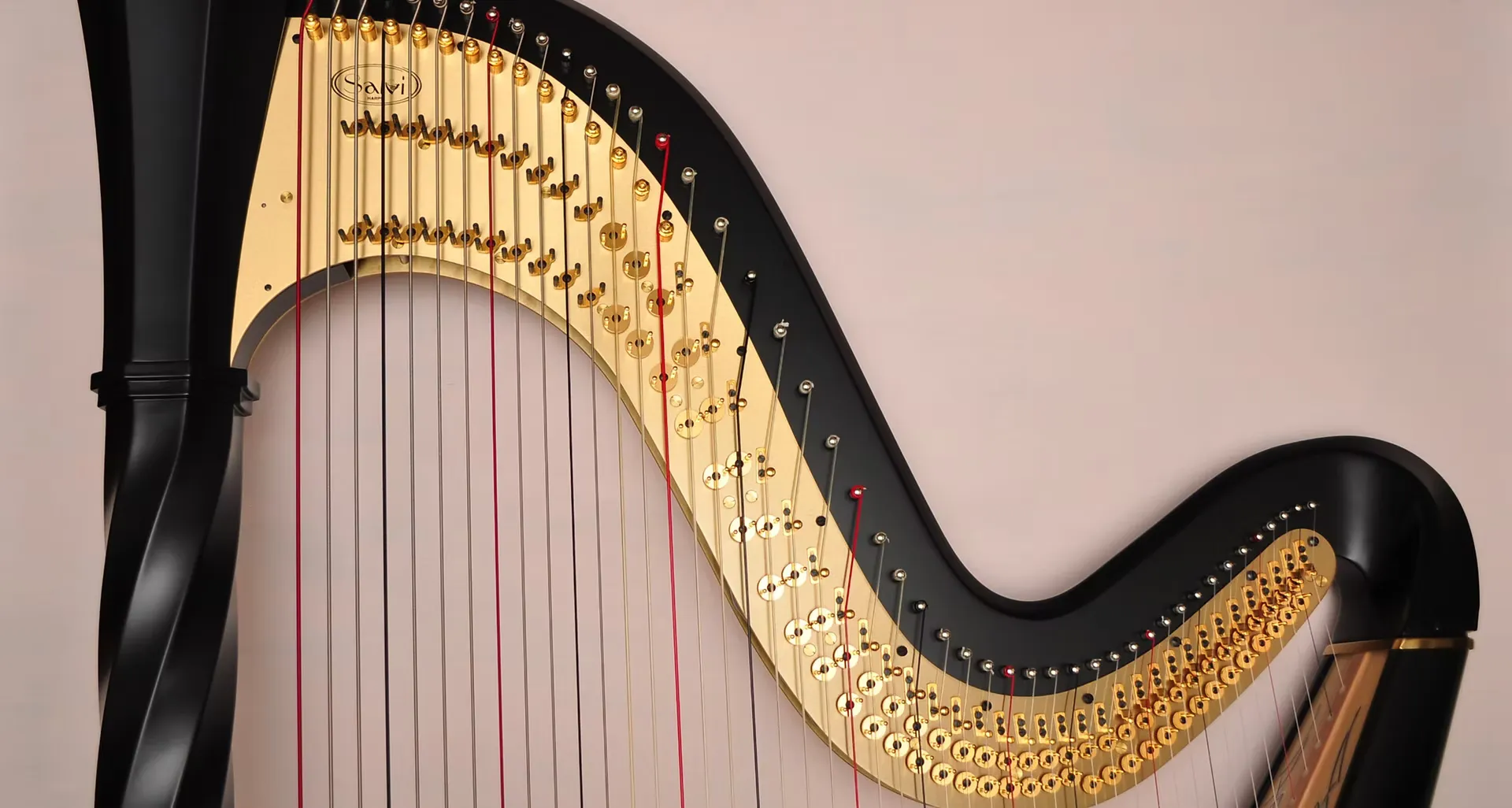 Angharad's harp on a pink background.